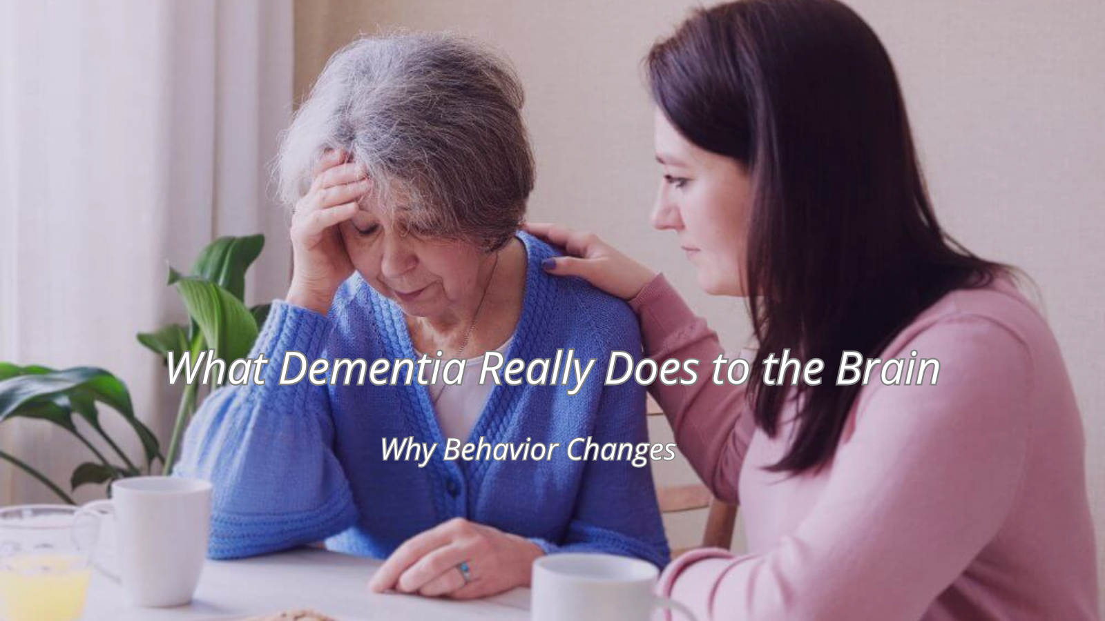 Daughter supporting her mother with dementia as they talk together at home