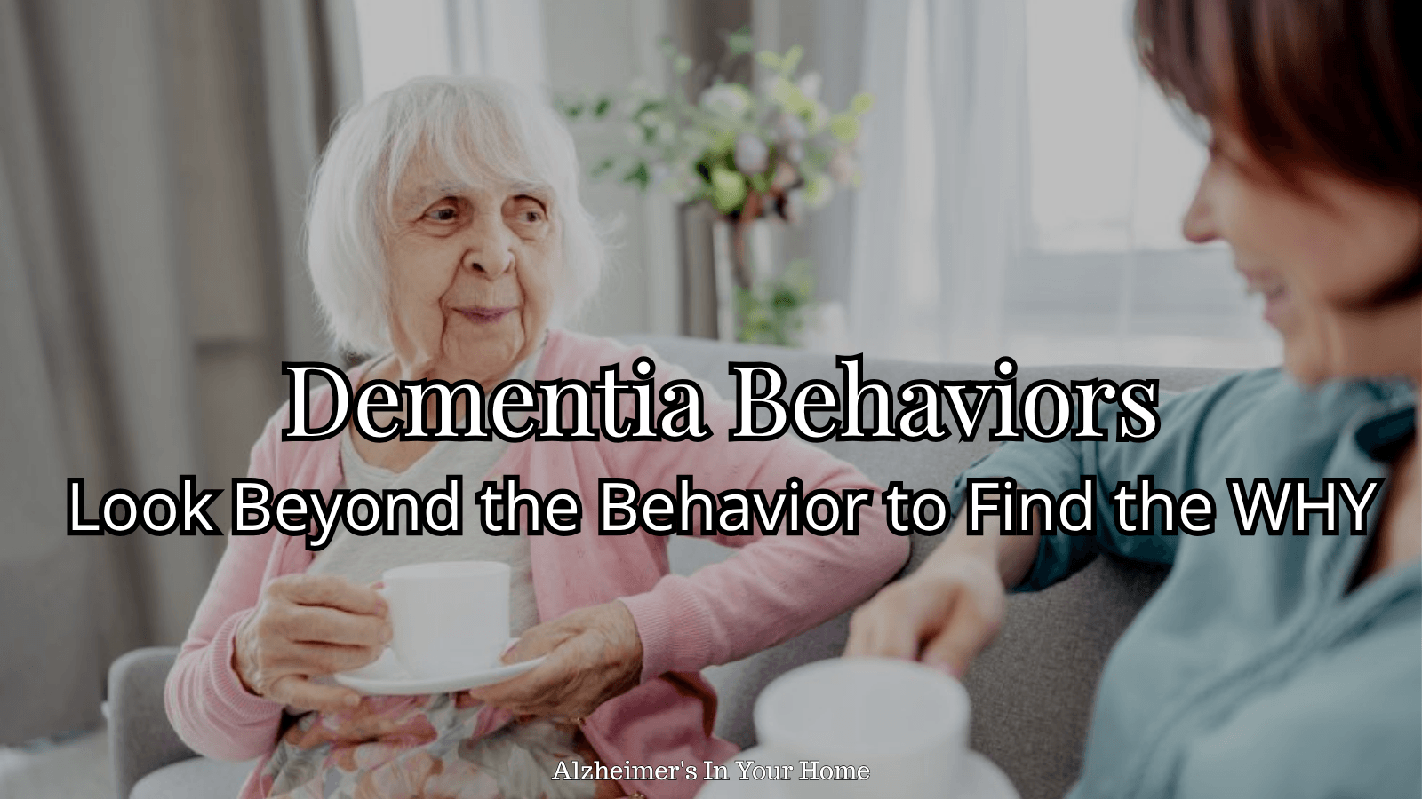 Caregiver talking with an older woman while learning to look beyond dementia behaviors to find the reason behind them.